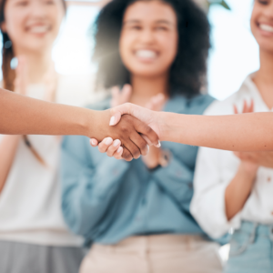 Women shaking hands and networking